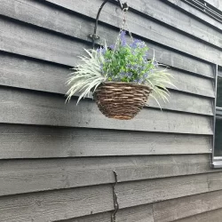 Black Featheredge External Cladding with a flower port hanging outside