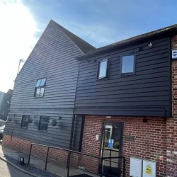 Black Featheredge External Cladding with a mixture of the farm brick